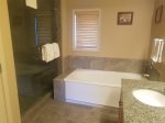 Primary bathroom with soaking tub and walk-in shower
